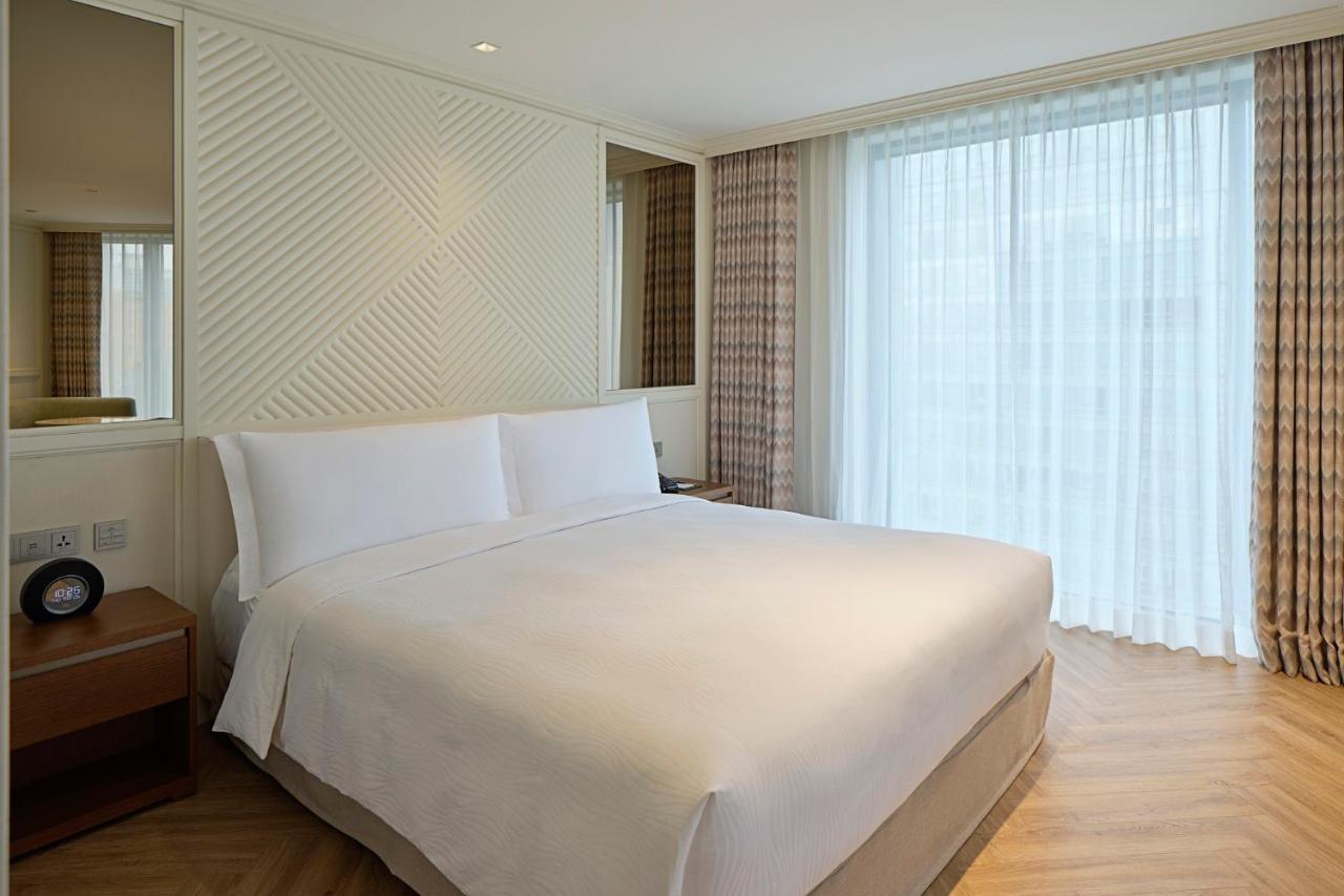 Grand Josun Busan Exterior foto A bedroom at the hotel